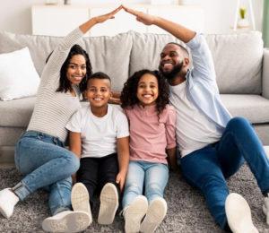 Parents hold their arms up and over their children to guide and protect.