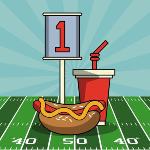Hot dog and soft drink on a football field